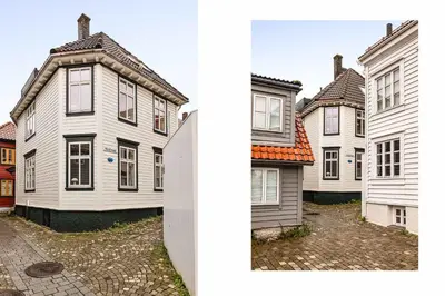 a group of white houses next to each other at Modern 1BR in heart of old town in Bergen