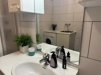 a bathroom with a sink and a mirror at Ski slopes nearby - Parking & WiFi in Vossevangen