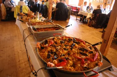 a buffet of food on a table with a pizza at Gunnabuda in Longva