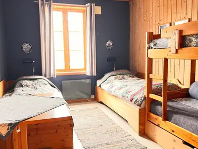 a bedroom with two bunk beds and a window at Gunnabuda in Longva