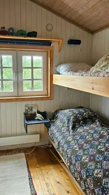 a bedroom with two bunk beds in a cabin at Family Cabin Near Rallarvegen And Geilo in Ustaoset