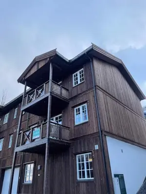 a wooden building with balconies on the side of it at Stranda Fjellgrend 3 bedrooms - 29C in Stranda