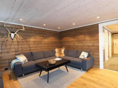 a living room with a couch and a table at Stranda Fjellgrend 3 bedrooms - 32A in Stranda