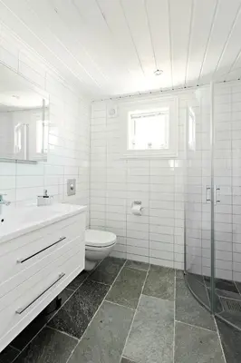 a white bathroom with a toilet and a sink at Stranda Fjellgrend 2 bedrooms and loft - 32B in Stranda