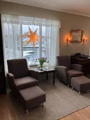 a living room with a star on the window at Holiday home in Espevær in Bømlo