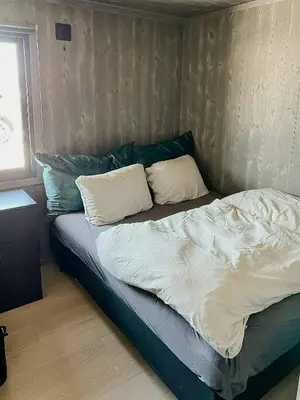 a bed with two pillows on it in a bedroom at Opplev Den Unike Stemningen På Golsfjellet in Gol