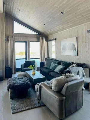 a living room with a couch and a table at Opplev Den Unike Stemningen På Golsfjellet in Gol