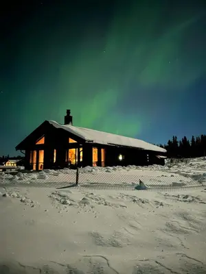 a house in the snow with lights on at Opplev Den Unike Stemningen På Golsfjellet in Gol