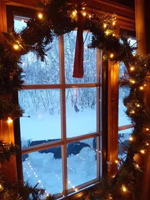 a christmas window view of a snow covered yard at Bjorlicabin in Bjorli