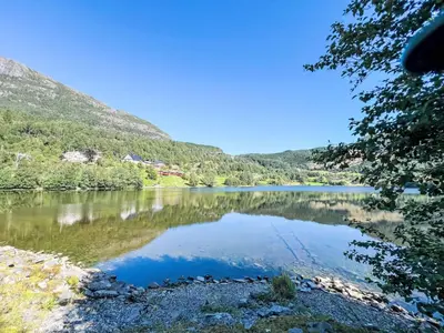 a view of a lake with mountains in the background at Apartment Samlen Vasselgård by Interhome in Herand