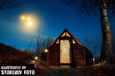 a small cabin with the moon in the sky at Hessdalen Ufocamp in Vårhus