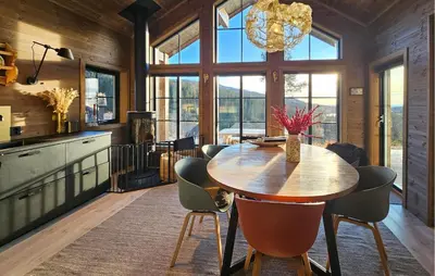 a dining room with a wooden table and chairs at Lovely Home In Eggedal With Wifi in Eggedal