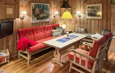 a living room with a red couch and a table at 4 Bedroom Nice Home In Trysil in Trysil