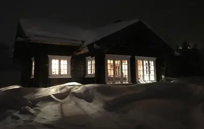 a painting of a person laying on the snow in front of a house at 4 Bedroom Pet Friendly Home In Svingvoll in Svingvoll