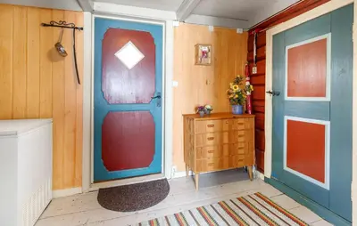a room with a door and a dresser in a room at 2 Bedroom Stunning Home In Bjugn in Moen