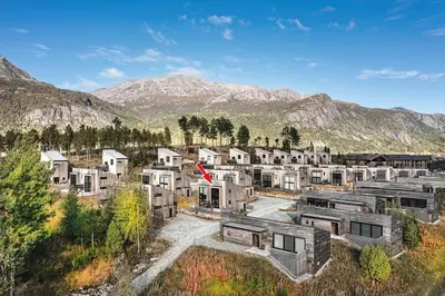 an aerial view of a village in the mountains at Charming and modern ski-in ski-out cottage in Hemsedal