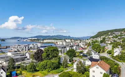 an aerial view of a city with a body of water at Lundenhuset 1917 - historic house in the heart of Ulsteinvik in Ulstein