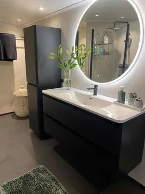a bathroom with a sink and a mirror at Penthouse apartment 2 bedrooms 70 m2 in Verdal