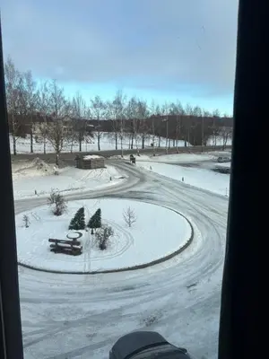 a winter view of a road with snow on the ground at Penthouse apartment 2 bedrooms 70 m2 in Verdal