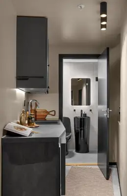 a kitchen with a black counter and a sink at Tromsø Apartment - in the heart of the city in Lii