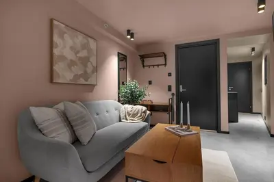 a living room with a couch and a table at Tromsø Apartment - in the heart of the city in Lii