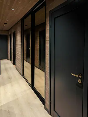 a row of glass doors in a hallway at Cabin With Ski Inout Near Stryn Alpine Resort in Stryn