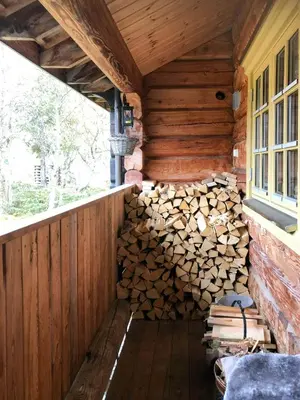 a pile of fire wood in a log cabin at Log Cabin Near Muen And Myafallene in Venabygd