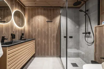 a bathroom with a shower and a sink at New luxury cabin in Geilo with hot tub, mountain views & ski access in Geilo