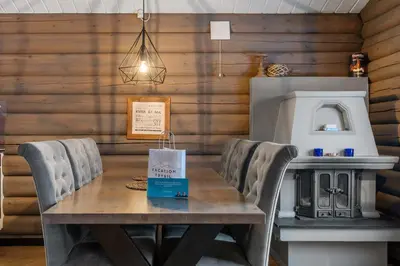 a dining room with a wooden table and chairs at Vikinggrenda 16A by Vacation Trysil in Trysil