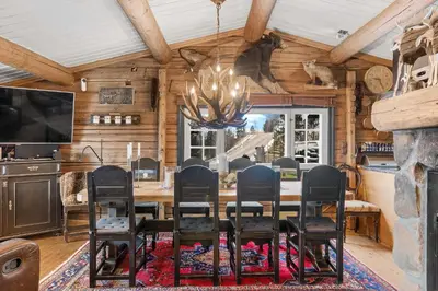 a dining room with a table and chairs at Trysilfjell hytteomrade 587 by Vacation Trysil in Hovi