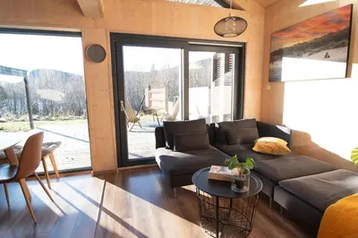 a living room with a couch and a table at Unique Nature Hideaway Close to Norefjell