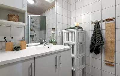 a white bathroom with a sink and a mirror at 3 Bedroom Gorgeous Home In Nesbyen in Nesbyen