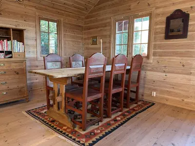 a wooden dining room with a wooden table and chairs at Family cabin in Hafjell, ski in-ski out in Hafjell