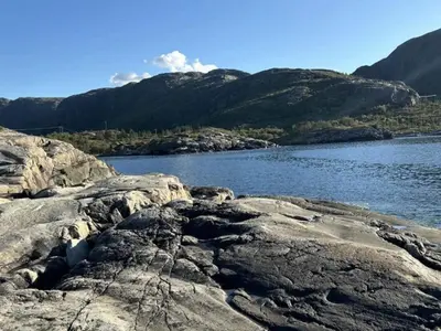 a large body of water with mountains in the background at 5 person holiday home in Flatanger in Vik