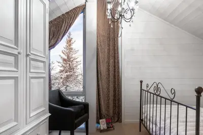 a room with a chair and a window at Fjellspa med Fantastisk utsikt og Høy standard in Aurdal