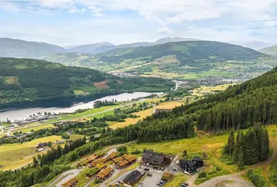 an aerial view of a valley with a river and houses at Exclusive and Uniqe Apartment - Ski in ski out! in Vossevangen