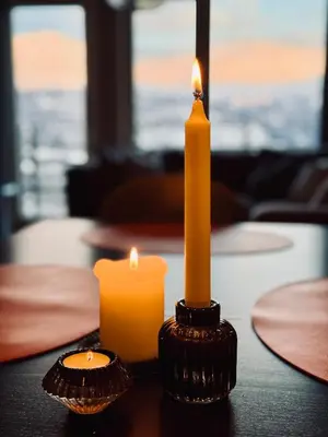 two candles sitting on top of a table at Hemsedal, Ski-in ski-out, Skarsnuten Panorama in Hemsedal