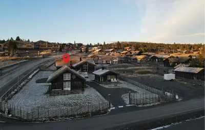 an aerial view of a village with houses and a road at Lovely Home In Sjusjøen With Sauna in Sjusjøen