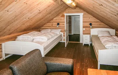a bedroom with two beds in a attic at Lovely Home In Sjusjøen With Sauna in Sjusjøen