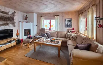 a living room with a couch and a coffee table at Amazing Apartment In Edland With House Sea View in Nesland