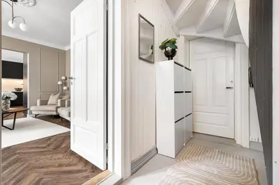a hallway with a door leading to a living room at Classic apartment with good standard in the city center in Trondheim
