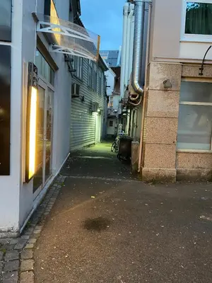 an alleyway between two buildings in a city at Modern apartment on Bryggen Walking distance to everything! in Bergen