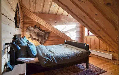 a room with a bed in a wooden attic at Amazing Apartment In Bjorli With Wifi in Bjorli