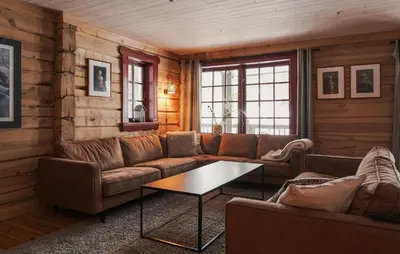 a living room with a couch and a table at Gorgeous Apartment In Bjorli With House A Panoramic View in Bjorli