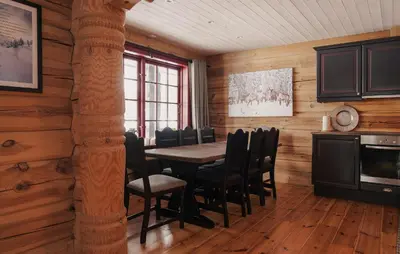 a dining room with a table and chairs at Gorgeous Apartment In Bjorli With House A Panoramic View in Bjorli