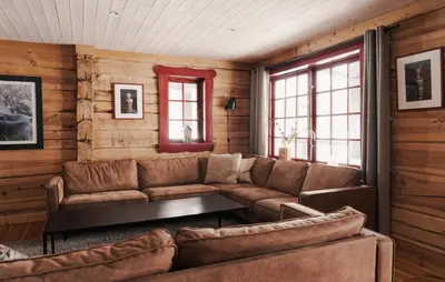a living room with a couch and a table at Gorgeous Apartment In Bjorli With House A Panoramic View in Bjorli