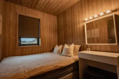 a small room with a bed and a window at Luxury cabin, Wellness and view over the Tyrifjord in Vikersund