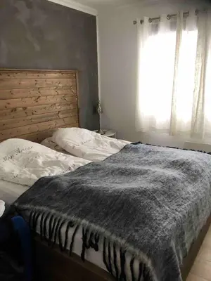 a bedroom with two twin beds and a window at House with oceanview, 4 bedrooms, close to Bergen in Alversund