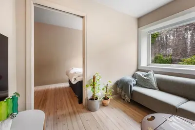 a living room with a couch and a window at Cozy Apartment in Bergen in Bergen