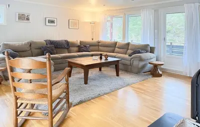 a living room with a couch and a coffee table at Beautiful Home In Kvammen With House A Panoramic View in Kvammen